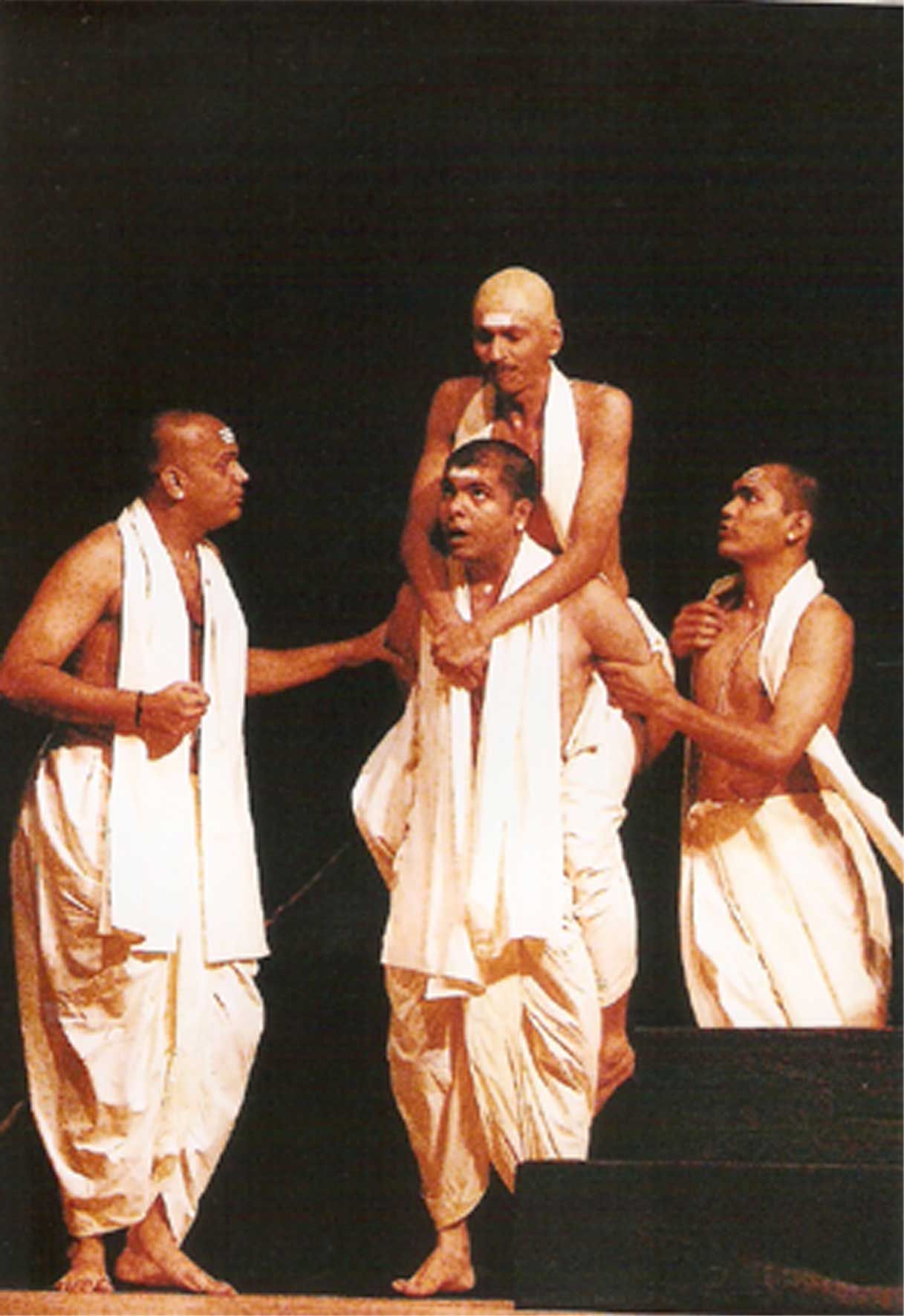 Ashram students in white — the rigid institution of Achalayatan