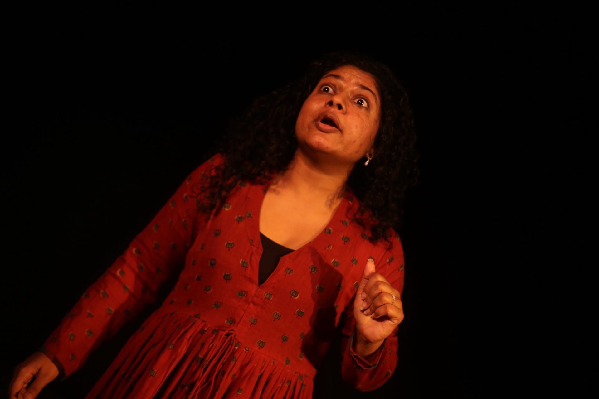 Dr. Anandibai: Like, Comment, Share — dramatic lighting against darkness