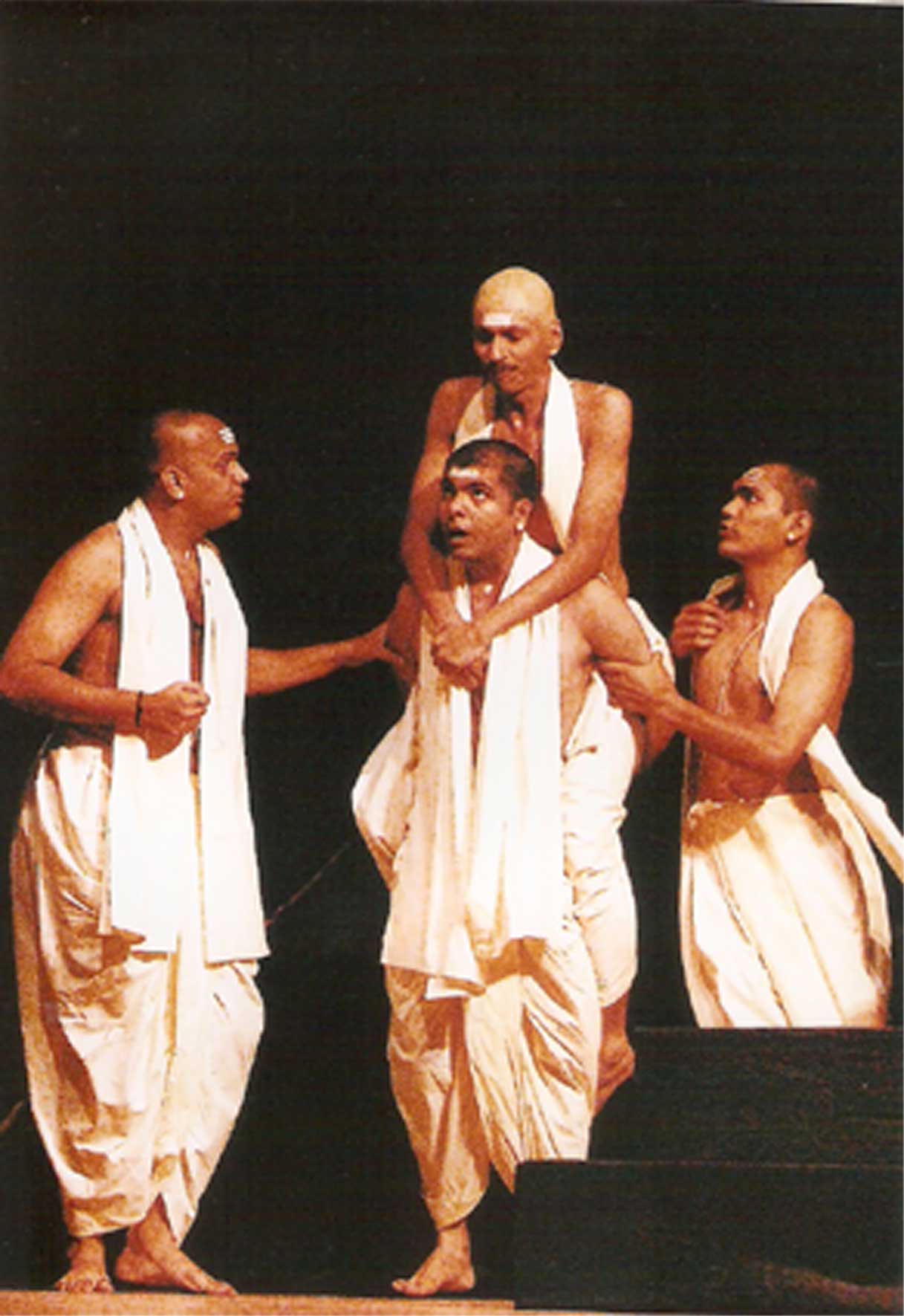 Ashram students in white — the rigid institution of Achalayatan