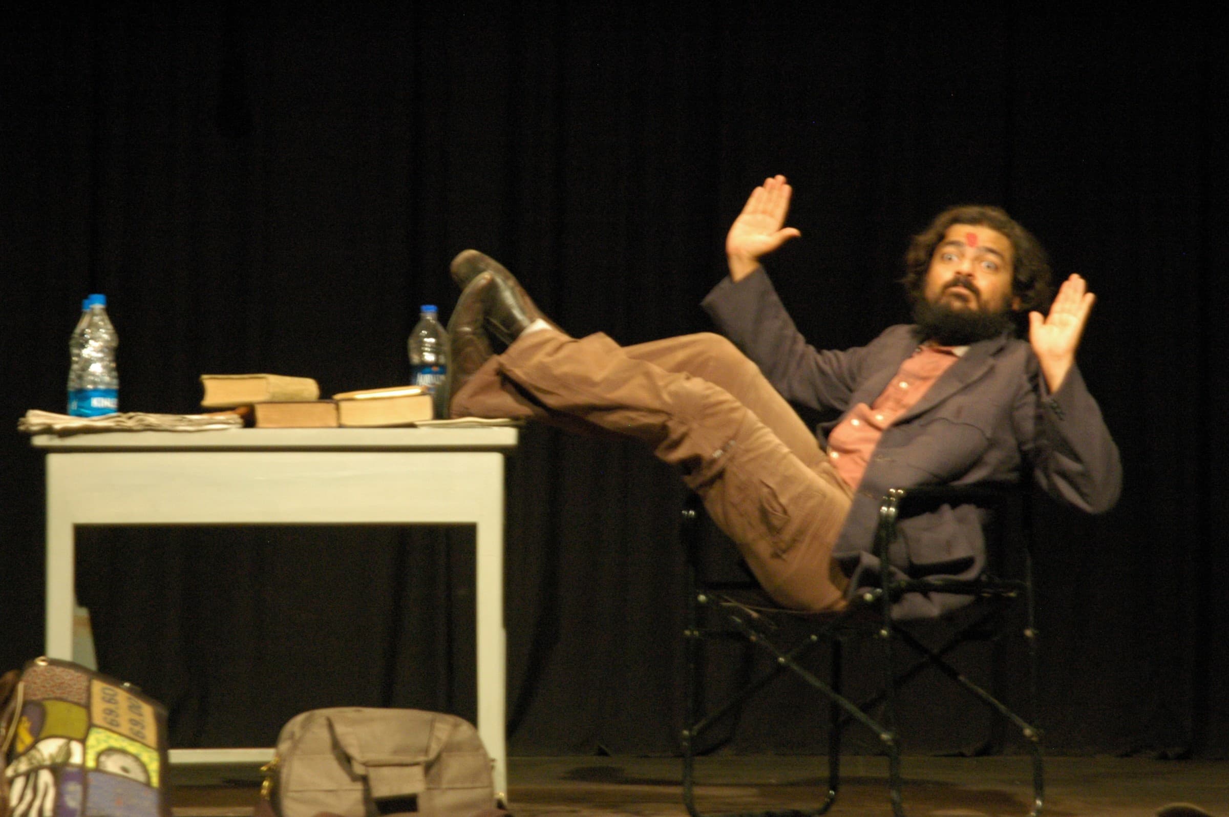 Satchit Puranik as Karl Marx at Prithvi Theatre — feet up, holding court